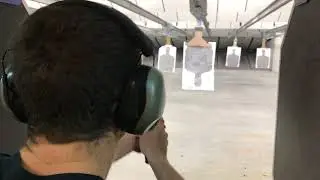 Ron Grobman splits a business card with a Wilson Combat GLOCK 19