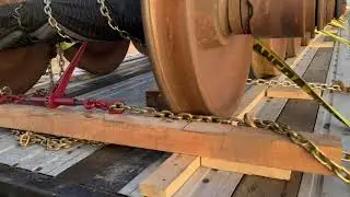 How to secure a train axles ( train wheel set ) on a flatbed trailer