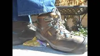 Keen boot crunch on a trash bag box
