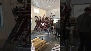 Woodpecker Jr. automated pallet production machine with stacker.