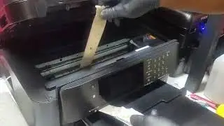 Cleaning plastic rollers on Epson WF-7710 with ribbon