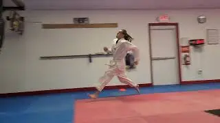 White Belt kicks a 300lb Muay Thai Pole Bag with a Flying Side Kick.
