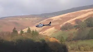 low flying helicopter over Derwent village