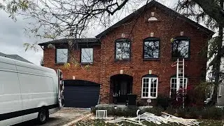 Before and after: replacing White exterior windows with post to Full glass black exterior windows