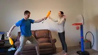 Juggling Couple Make Mini Basketball Trick Shots - 1118702