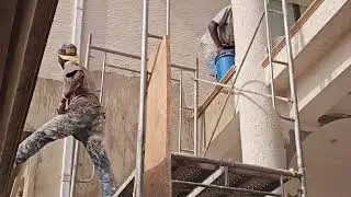 BUILDING IN GHANA...APPLICATION OF GRAVITEX PAINT ON BUILDING EXTERIOR