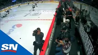 Alex DeBrincat Wipes Out Collin Delia During Blackhawks' Warm Ups