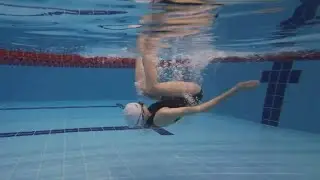How can beginners learn to turn over underwater?