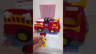 Showing the Mickey Mouse toy fire truck and the sounds it makes