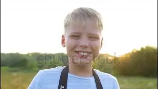 Little cute photographer holding new black mirrorless Sony Alpha A7 III camera with kit 28-70