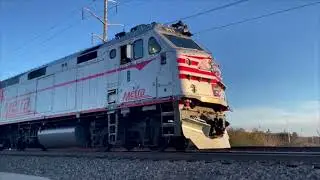 METRA 211 DEPARTS Rt 59 with holiday lights on 11/30/2024