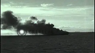 USS Ommaney Bay (CVE-79) burns at Sulu sea in Philippines following kamikaze atta...HD Stock Footage