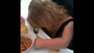 Lilli sleeping in high chair