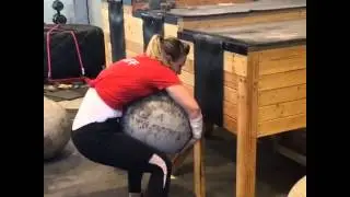 Female Strongman Lifting a 250lb atlas stone to 46