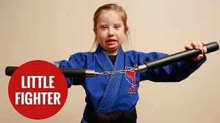 Eight-year-old with Down's Syndrome receives black belt in MMA