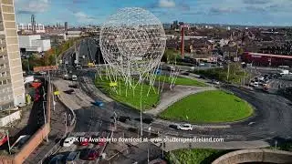 Aerial video of The Rise Sculpture Landmark Globe Shaped Belfast City Northern Ireland 2 4K