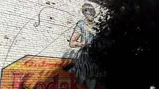 Mural of a Woman Sitting on a Box of Kodak Film, Near Paul Wolk Commons on Lake Avenue in Rochester,
