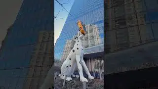 Giant Dalmatian balances NYC taxi on nose #publicart #art