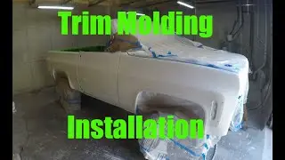 Fitting side trim on C10 K5 square body Chevy trucks.