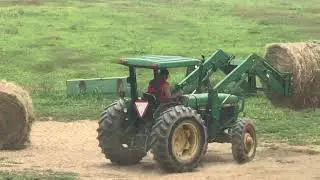 Stacking round bales