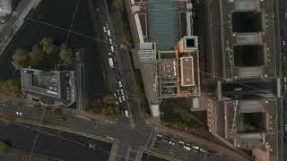 Aerial birds eye overhead top down view of road intersection on winter bank in modern business urban