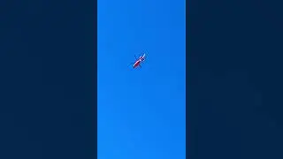 Red Orange Helicopter 🚁 Flying Overhead on a clear blue sky day