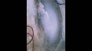 Removing Debris From an Empty Pool to Prepare for Restoration