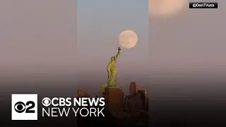 Video shows supermoon rising behind Statue of Liberty