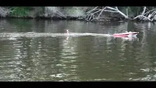 Large RC Riva towing a water skier