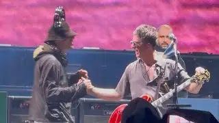 Liam and Noel joke around during the final minutes of the first Wembley Oasis 2025 show