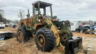 1979 International 530A Loader Hauling a Pickup