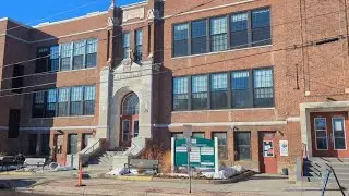 Reading from Sandy Baird's Obituary by the Old North End Community Center on Allen St