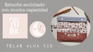 Estuche con cierre de snap. DT costura Alua Cid.