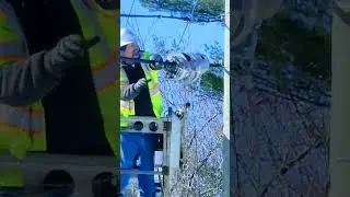 He is using a cable lasher to attach the fiber to the support strand .#fiberoptics #cable #attached