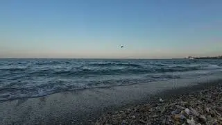 beach definition: sand and waves