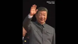 Xi waves to the crowds and the troops from the Tiananmen Tower