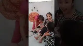 Shamla and Layma playing with puppies 