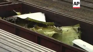 Debris from Malaysia Airlines flight MH17, which was shot down over rebel-held eastern Ukraine, arri