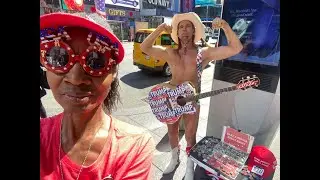 The Naked Cowboy and his Trump guitar in Times Square, New York City