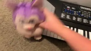 Tattletail Playing Piano