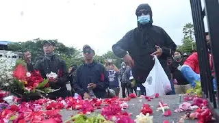 Indonesia's football fans throw petals in tribute to victims of deadly riot | AFP