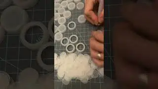 Turning bottle caps collected during clean-ups into jewelry #recycling #recycledjewelry #upcycling