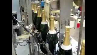 IC Filling Systems- Champagne style bottle capsuling and labelling machine
