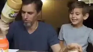 A father is reading the instructions made by his children and It so funny