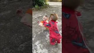 Subi monkey wants to steal Kimi's milk bottle