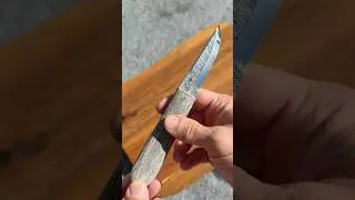 Modern puukko with handforged blade and black canvas micarta handle. It&rsquo;s for sale.