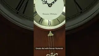 A Classic Pendulum Clock in Oak Wood