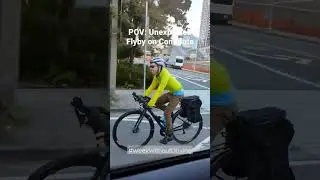 Заснято на камеру: велосипедист пролетает мимо потока машин