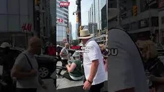 CAUGHT ON CAMERA: Masked trans activist hurls profanity at David Menzies