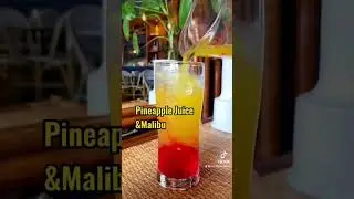 Rainbow Paradise #RainbowParadise #TropicalCocktail #ColorfulDrinks #SummerVibes #BeachCocktail